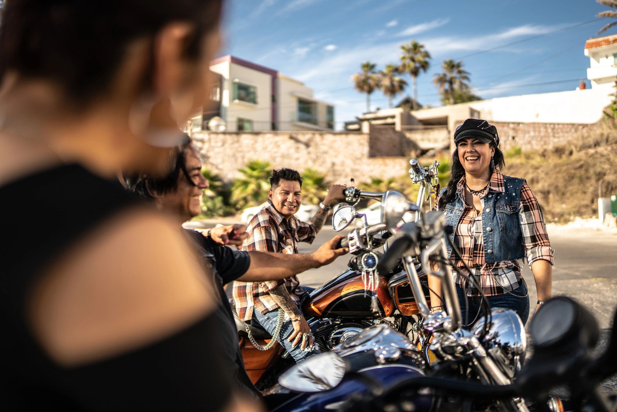 Motorcycle riders talking during a road trip stop